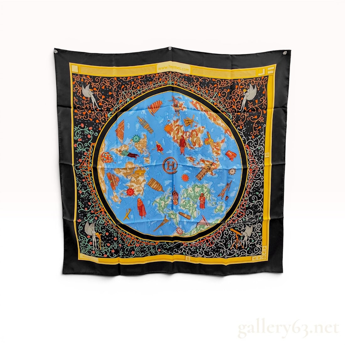 Hermes Silk Carre 90 Scarf in the www.hermes.com Pattern: Hermes silk twill Carre 90 scarf in the www.hermes.com pattern, designed by Cathy Latham for the year 2001. The screen-printed design features a central globe with world landmarks and figures, surroun