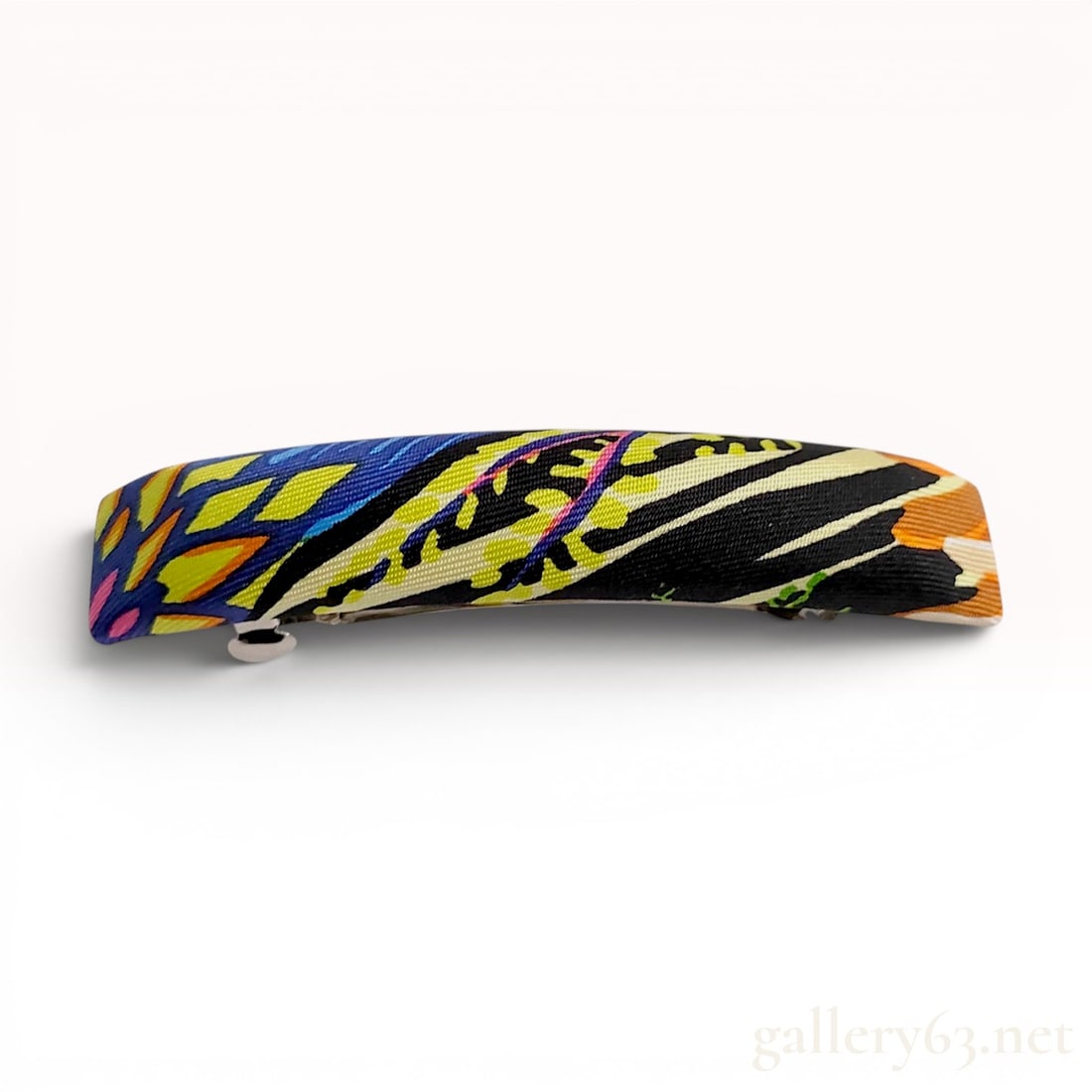 Hermes Silk Twill Eclipse Barrette Hair Clip with Box: A Hermes hair barrette featuring a silk twill exterior wrap over a silver-toned metal base. The silk covering displays a vibrant multi-color abstract animal-inspired print with motifs in shades of blu