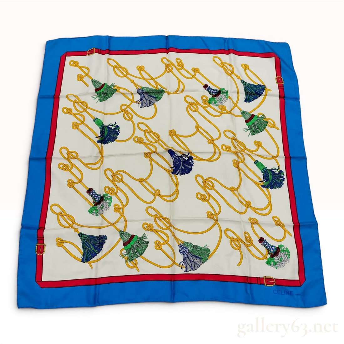 Celine Paris Vintage Silk Scarf with Tassel and Rope Motif: Vintage Celine Paris silk twill scarf featuring an equestrian-inspired rope and tassel motif on a cream field. The design includes intertwined golden yellow ropes terminating in multicolored tassels, 