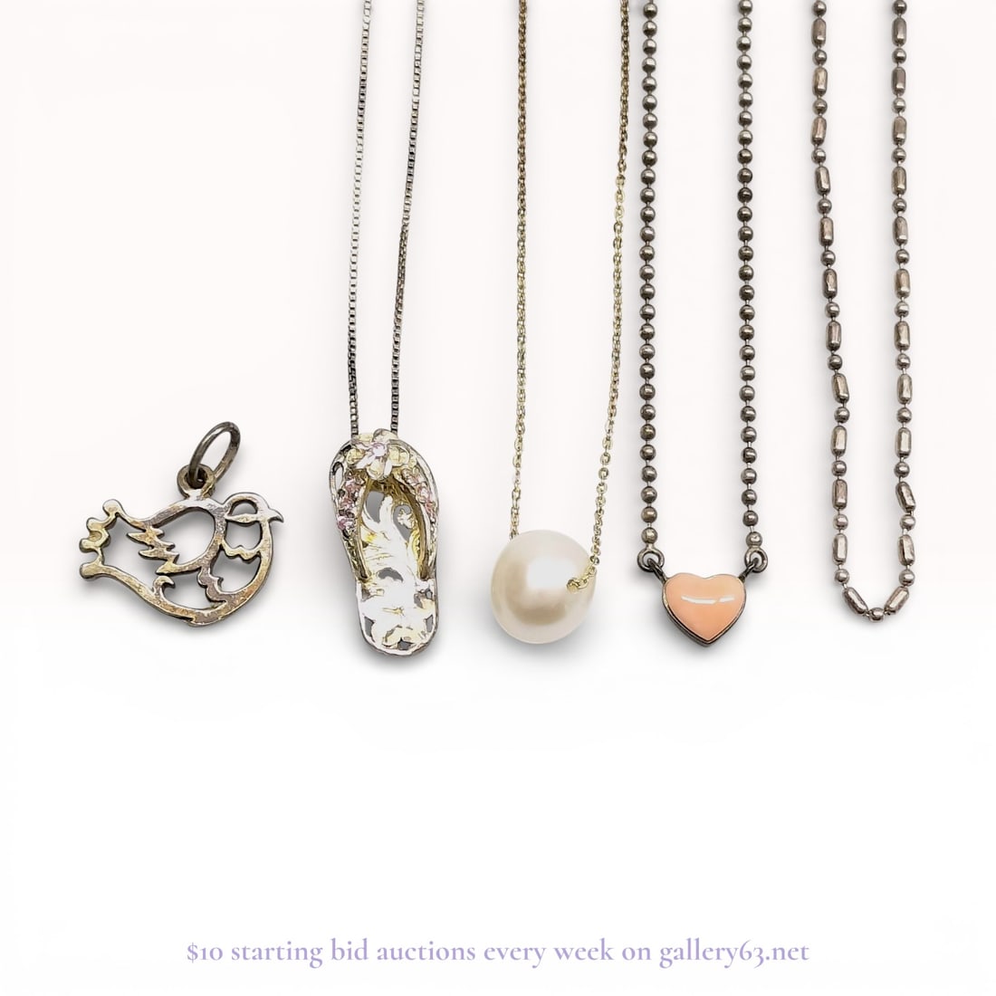 A Group of Sterling Silver and Vermeil Jewelry Including Pearl and Heart Pendants: A group of sterling silver and vermeil jewelry items, including pendant necklaces and charms, contemporary. The collection features a 10-12mm floating pearl on an adjustable cable chain, a stone-set f