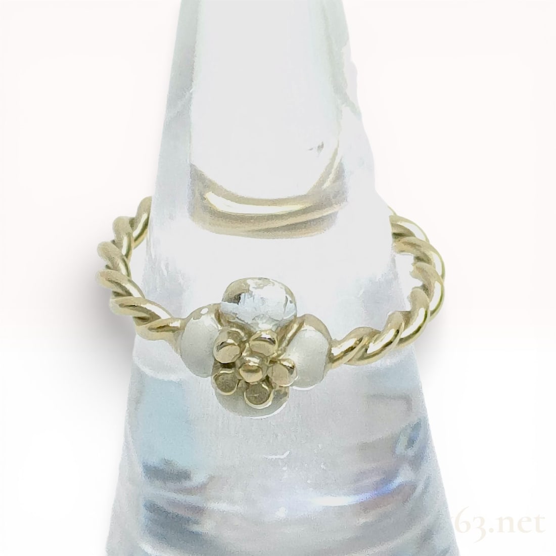 Chanel Camellia White Enamel and Crystal Gold-Tone Ring, Autumn 2008: Chanel costume jewelry ring from the Autumn 2008 collection featuring a stylized white enamel camellia flower. The central motif is set with a round faceted clear crystal in a multi-prong setting atop
