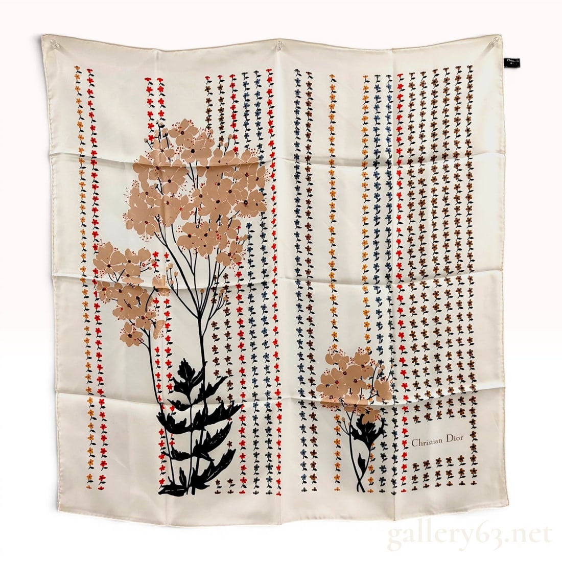 Christian Dior Silk Scarf with Botanical Floral Pattern: Christian Dior silk twill scarf featuring a botanical floral motif, late 20th century. The composition depicts large stylized floral silhouettes in beige and black bordered by vertical rows of small r