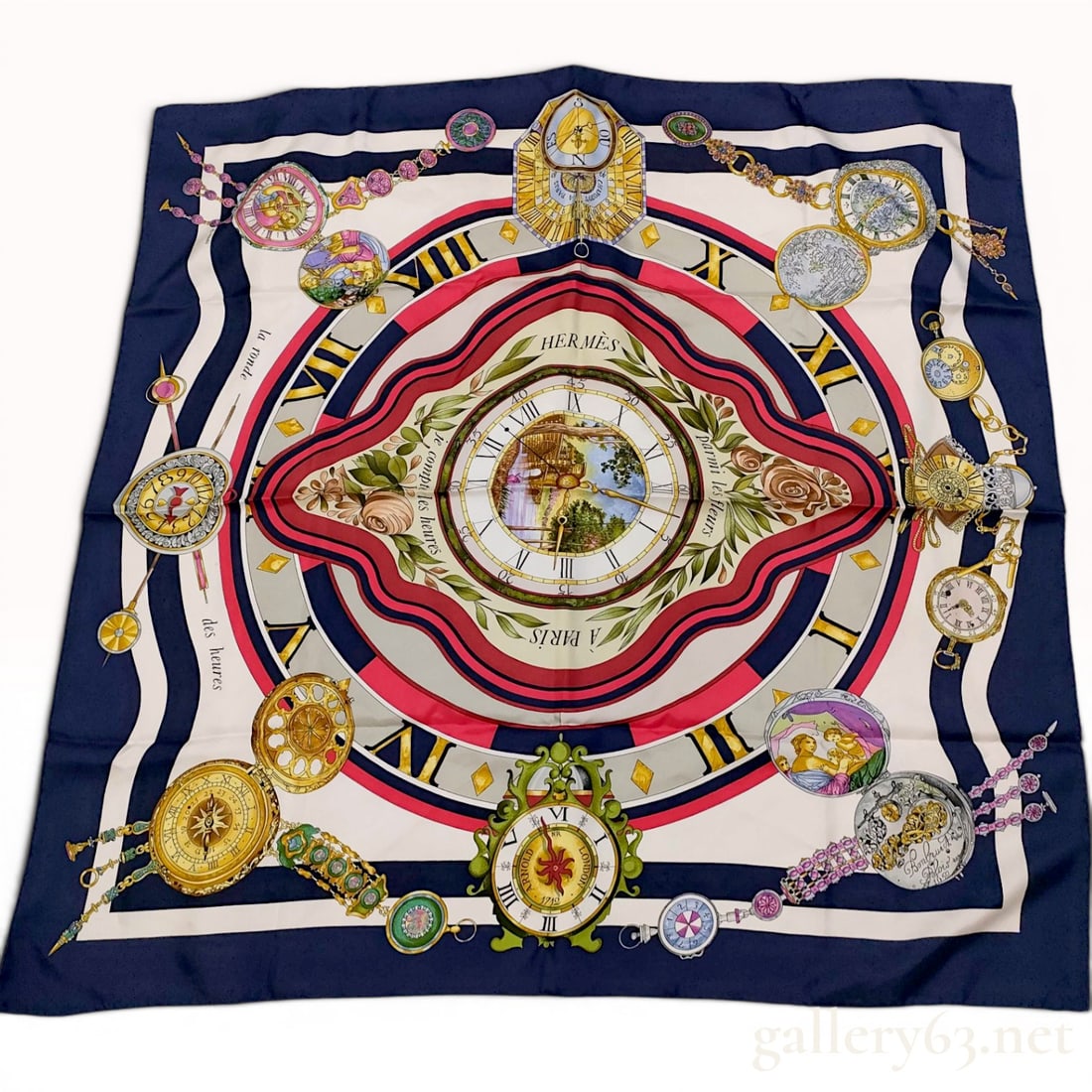 Hermes La Ronde des Heures 90cm Silk Twill Scarf: A Hermes silk twill scarf in the La Ronde des Heures pattern. The design consists of a central clock face with a pastoral scene, encircled by various antique horological elements including pocket watc