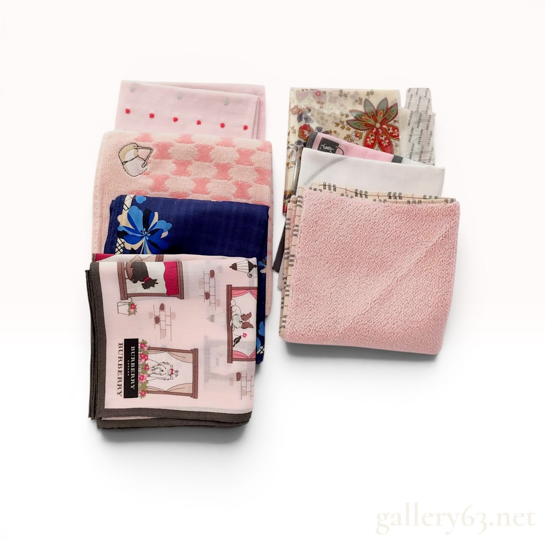 A Collection of Eight Designer Pocket Squares and Pocket Towels including Burberry, Christian Dior,: Assortment of eight luxury fashion house pocket squares and pocket towels featuring pieces by Burberry, Christian Dior, Celine, and Yves Saint Laurent. The collection includes a Burberry illustrated d
