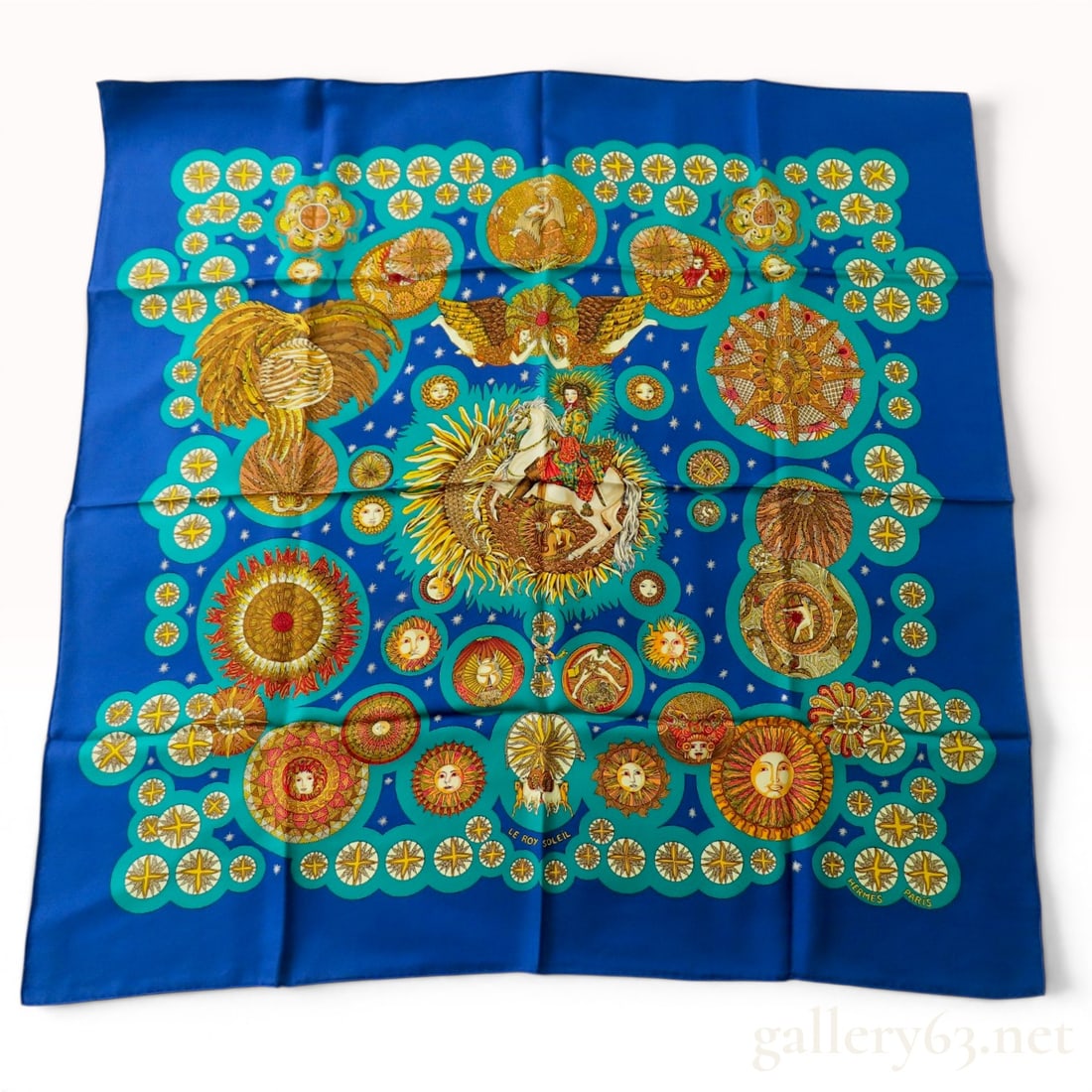Hermes Le Roy Soleil Silk Carre 90 Scarf by Annie Faivre: A Hermes silk twill scarf in the Le Roy Soleil pattern, designed by artist Annie Faivre. The central design depicts King Louis XIV on a white horse, surrounded by a complex celestial and solar-themed 