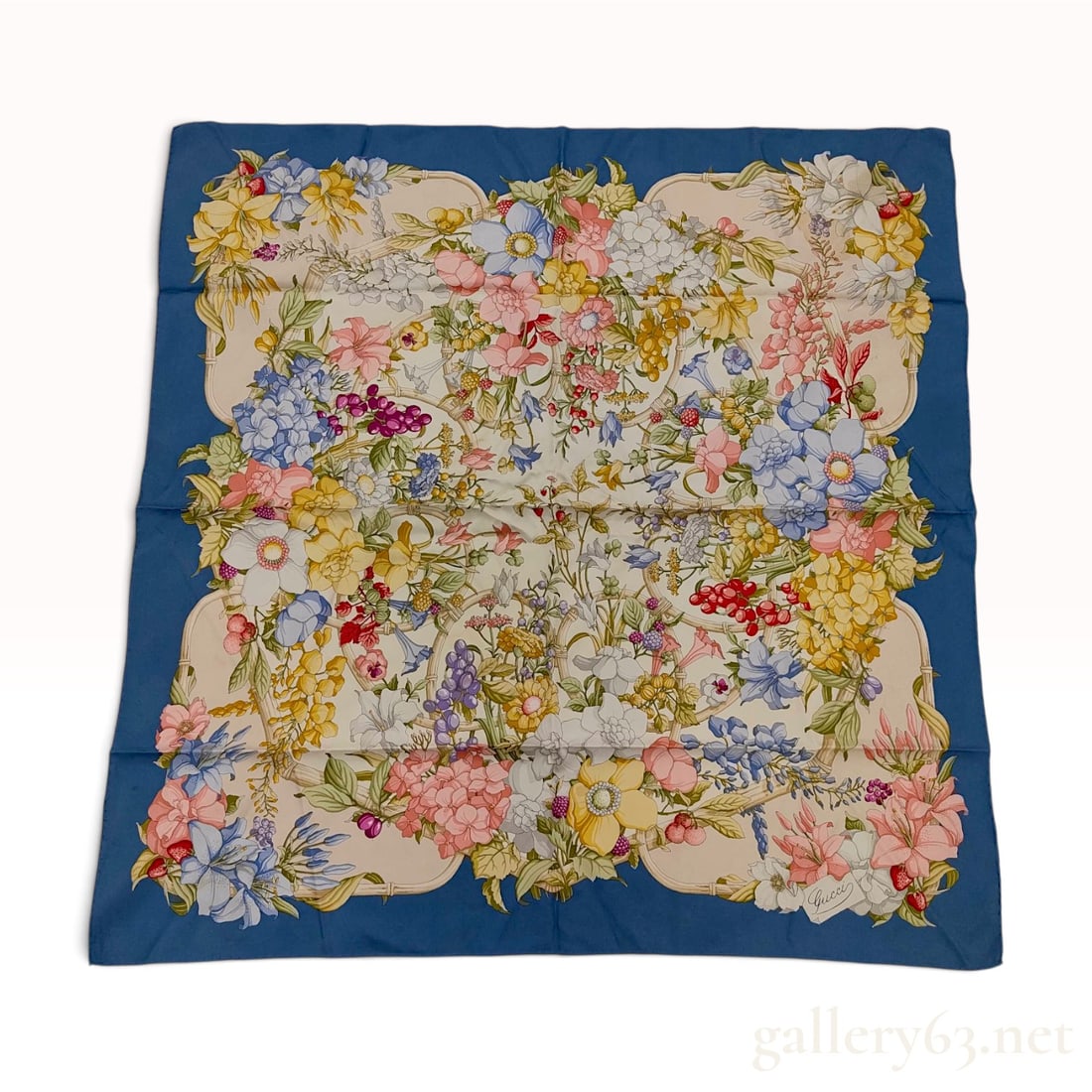 Gucci Flora Silk Scarf by Vittorio Accornero: A vintage Gucci silk scarf featuring the iconic Flora pattern designed by artist Vittorio Accornero. The design consists of a dense botanical arrangement of various wildflowers, fruits, and insects in