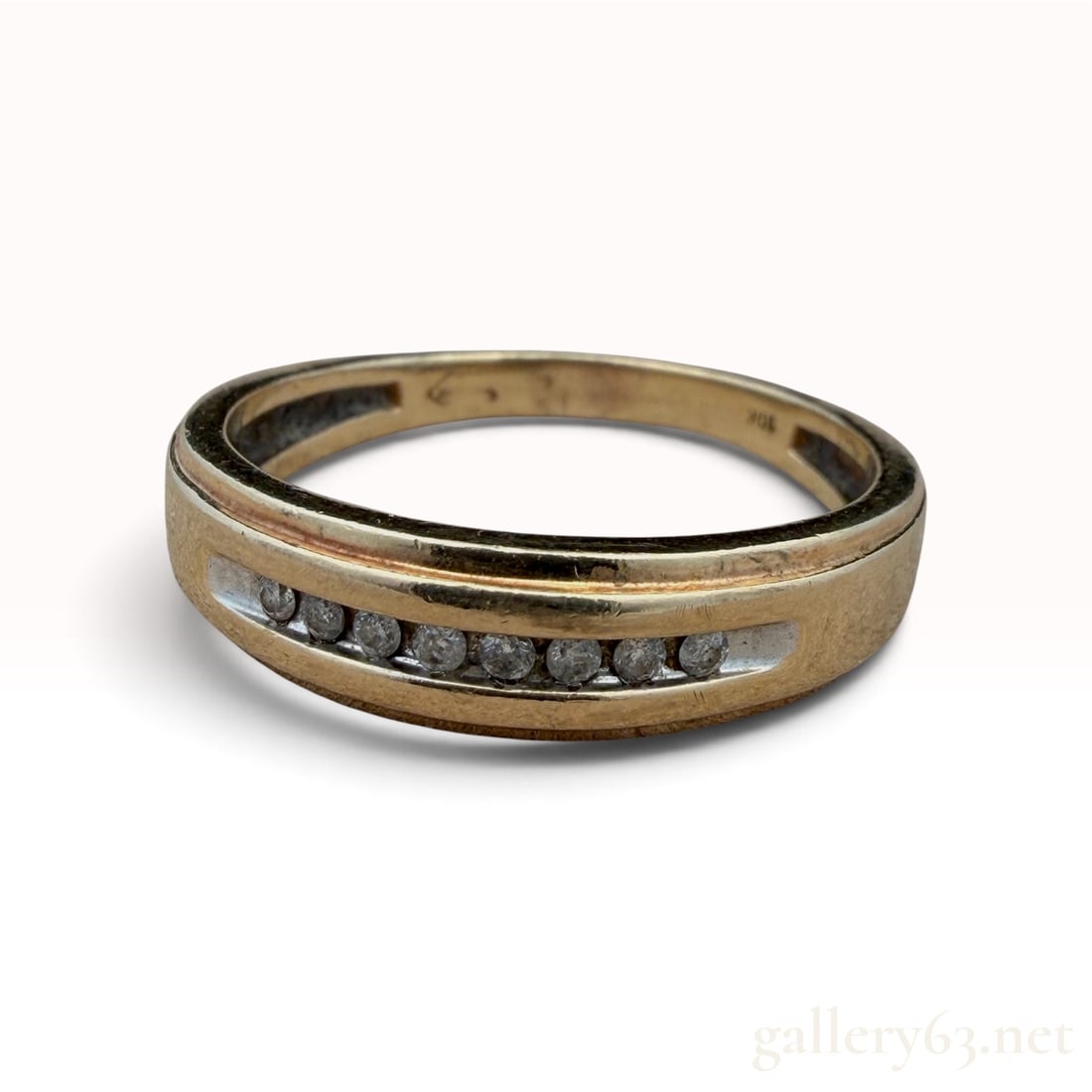 10k Diamond Ring: The lot features a 10k Diamond Ring with 0. 0.15 carat SI/I. Ring size 11 3.0 grams.