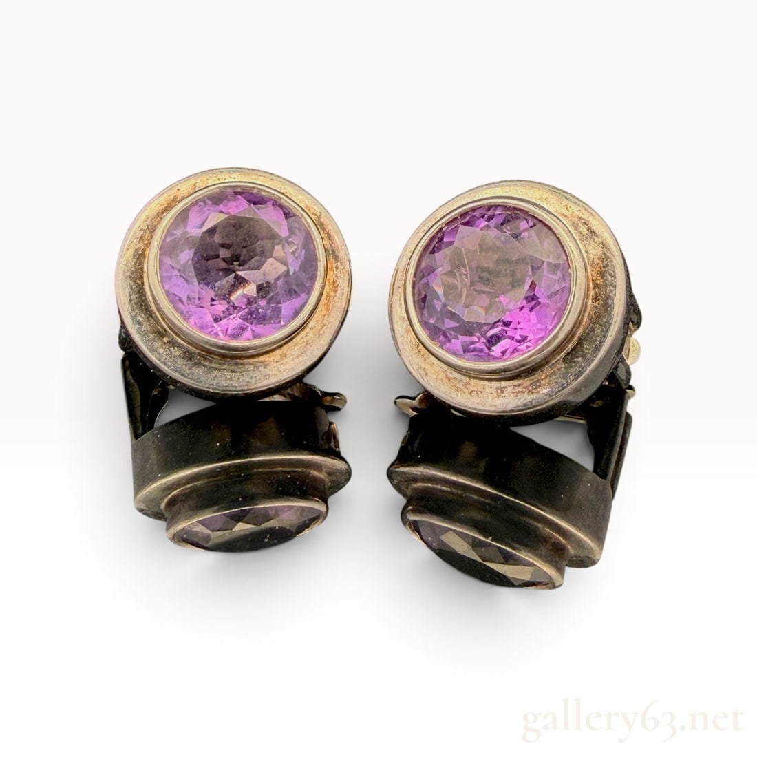 English Made Sterling Silver W/ Amethyst Earrings: The lot features a pair of English Made Sterling Silver W/ Amethyst Earrings with 10 carat total weight Amethyst.