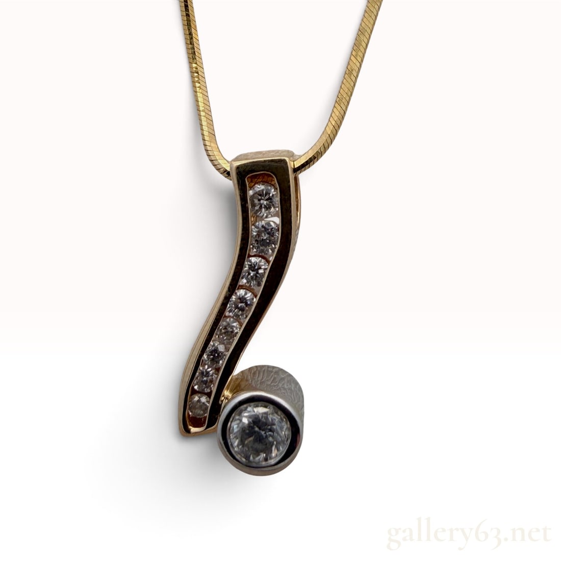 14k Yellow Gold Diamond Necklace: The lot features a 14k Yellow Gold Diamond Necklace with 0. 0.45 carats G/SI. 17" long 6.9 grams.