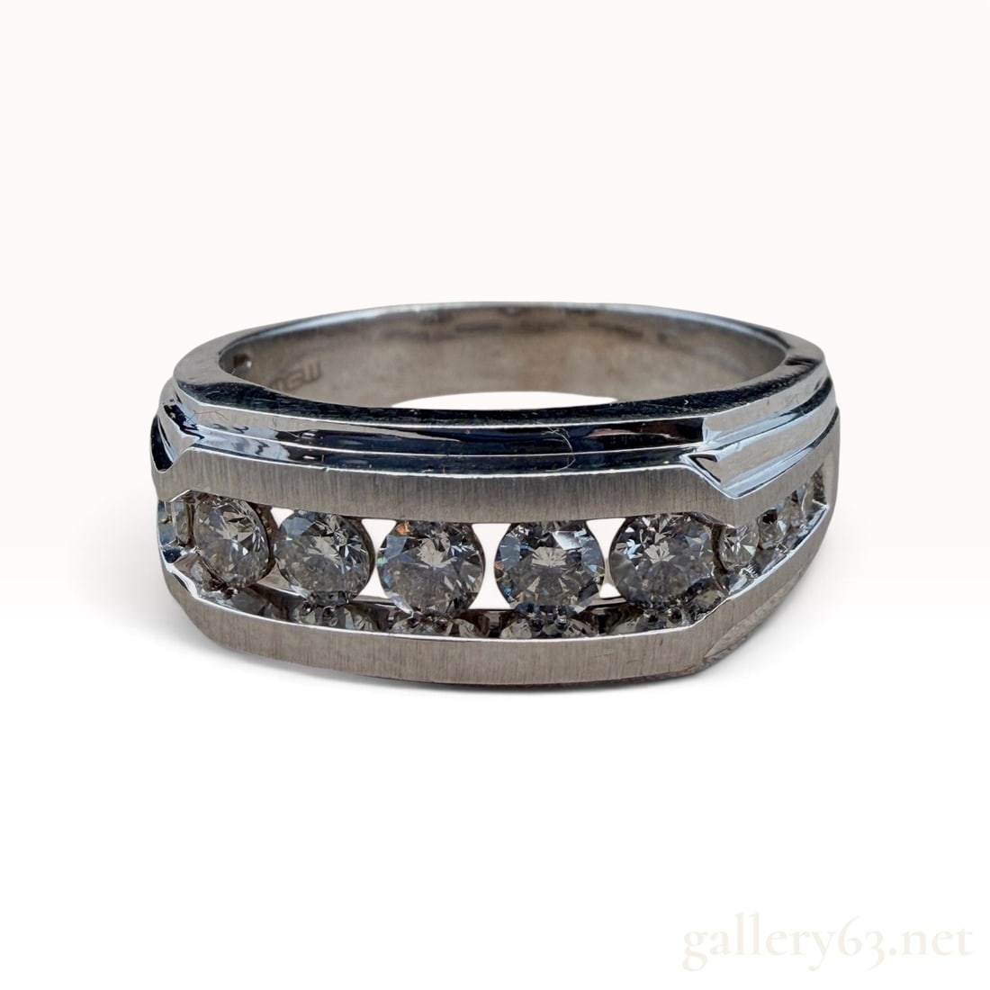 10k White Gold Men's Diamond Ring: The lot features a 10k White Gold Men's Diamond Ring with ring size 12.25 8.2 grams. 1 carat total weight H/SI diamonds.