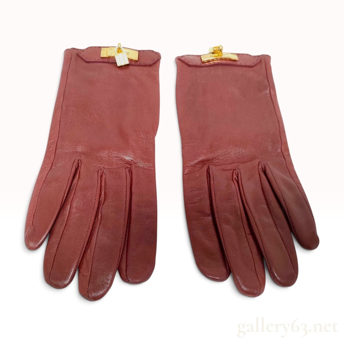 A Pair of Hermes Soya Burgundy Lambskin Leather Gloves with Gold-Tone Hardware (1 of 6)