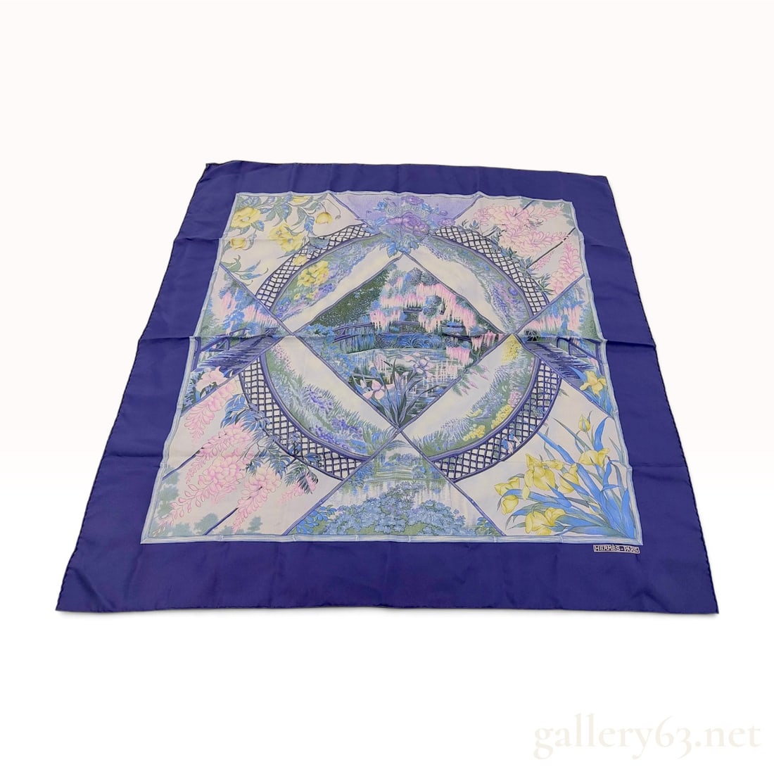 Hermes Giverny Silk Twill Scarf: A 100% silk twill scarf by Hermes featuring the Giverny pattern designed by Laurence Bourthoumieux. The design depicts a central floral scene inspired by Claude Monet's gardens, including water lilies