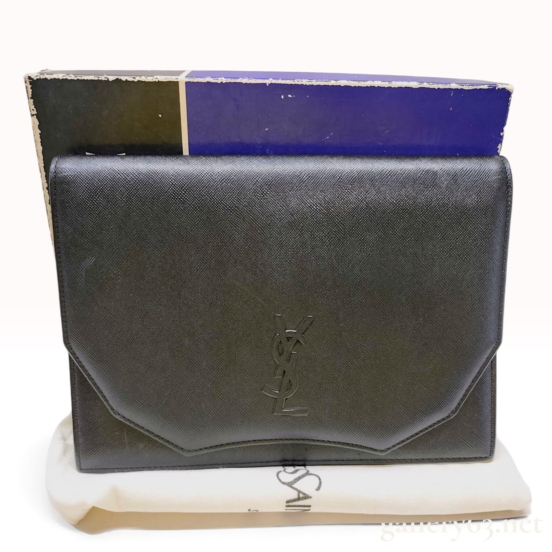 Yves Saint Laurent Vintage Black Saffiano Leather Envelope Clutch: This vintage Yves Saint Laurent envelope clutch is crafted from black Saffiano-grain leather, featuring a classic envelope silhouette with a V-shaped front flap. The exterior is detailed with a raised