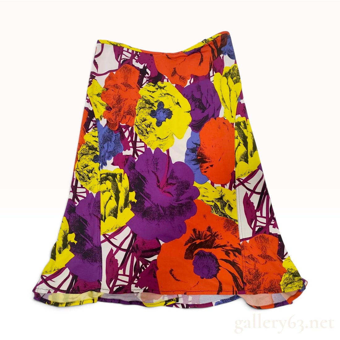 Gianni Versace Couture Spring Summer 2002 Floral Print Jersey Flared Skirt: A Gianni Versace Couture flared skirt from the Spring/Summer 2002 collection. The garment is constructed from a stretchy jersey knit fabric featuring an oversized multicolored floral print in shades o