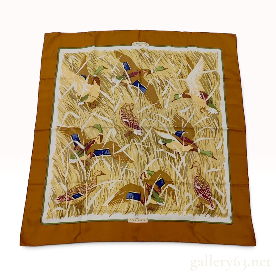 Hermes Cols-Verts Silk Scarf Designed by Xavier de Poret: An authentic Hermes silk scarf titled Cols-Verts, featuring a naturalistic design by artist Xavier de Poret. The pattern depicts various mallard ducks in flight and standing among tall grasses and ree