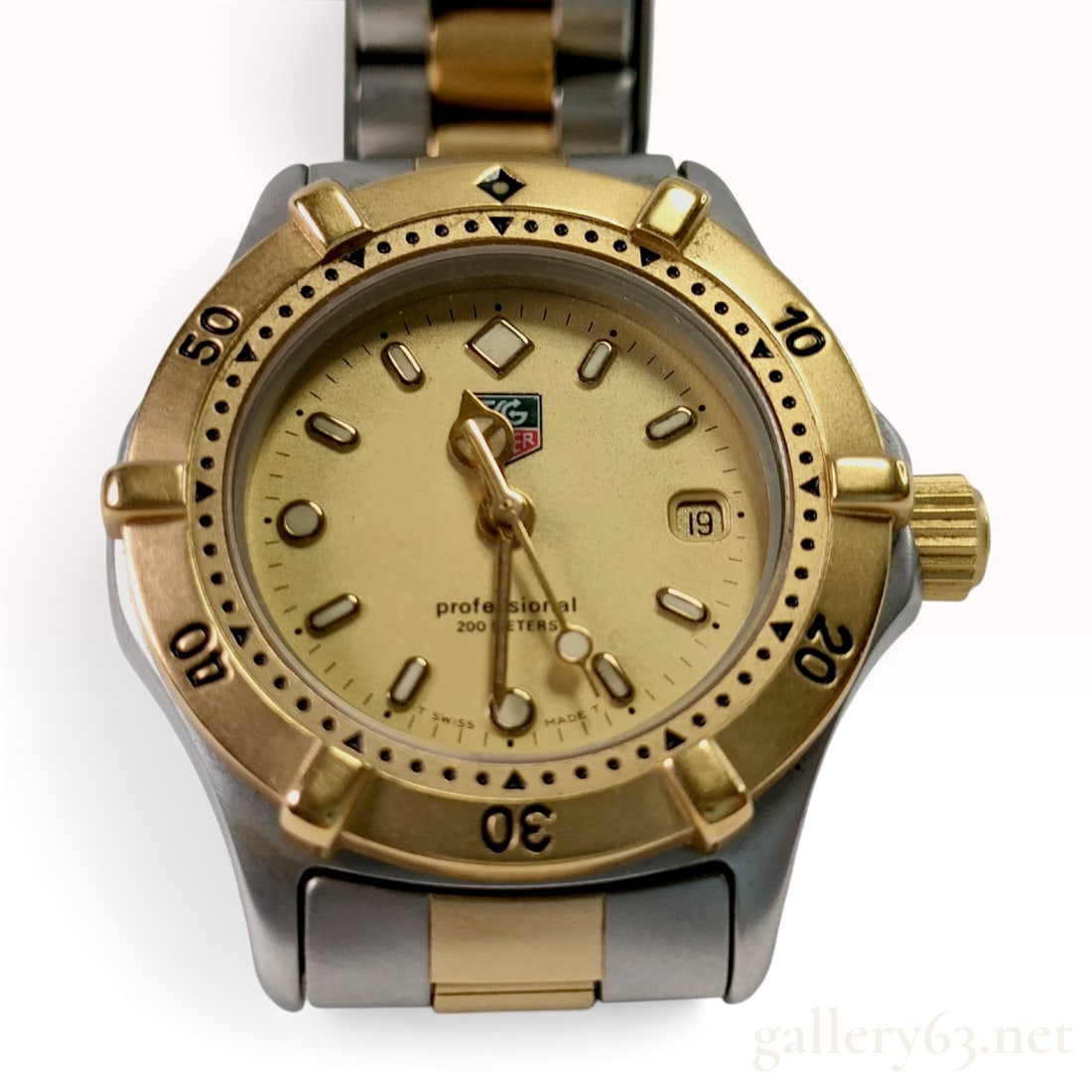 TAG Heuer Professional 200 Meters Ladies Wrist Watch Reference WE1420-R: A ladies two-tone TAG Heuer Professional 200 Meters wristwatch, reference WE1420-R. The timepiece features a stainless steel case with a gold-tone unidirectional rotating bezel and a champagne dial.