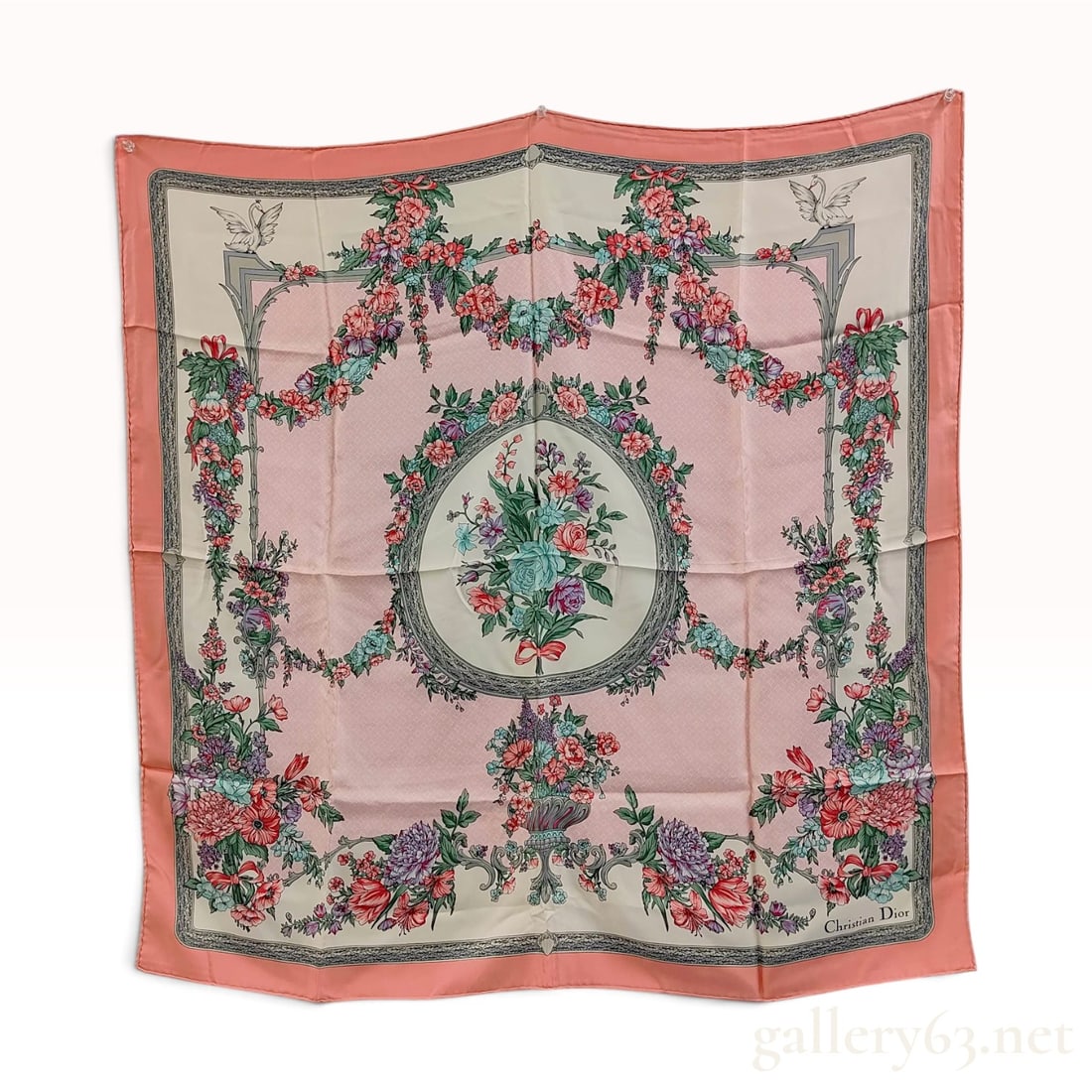 Christian Dior Pink Floral Silk Twill Scarf 90 cm: A square silk twill scarf by Christian Dior featuring a classical floral and architectural motif. The design centers on a circular medallion containing a multi-colored bouquet of flowers including