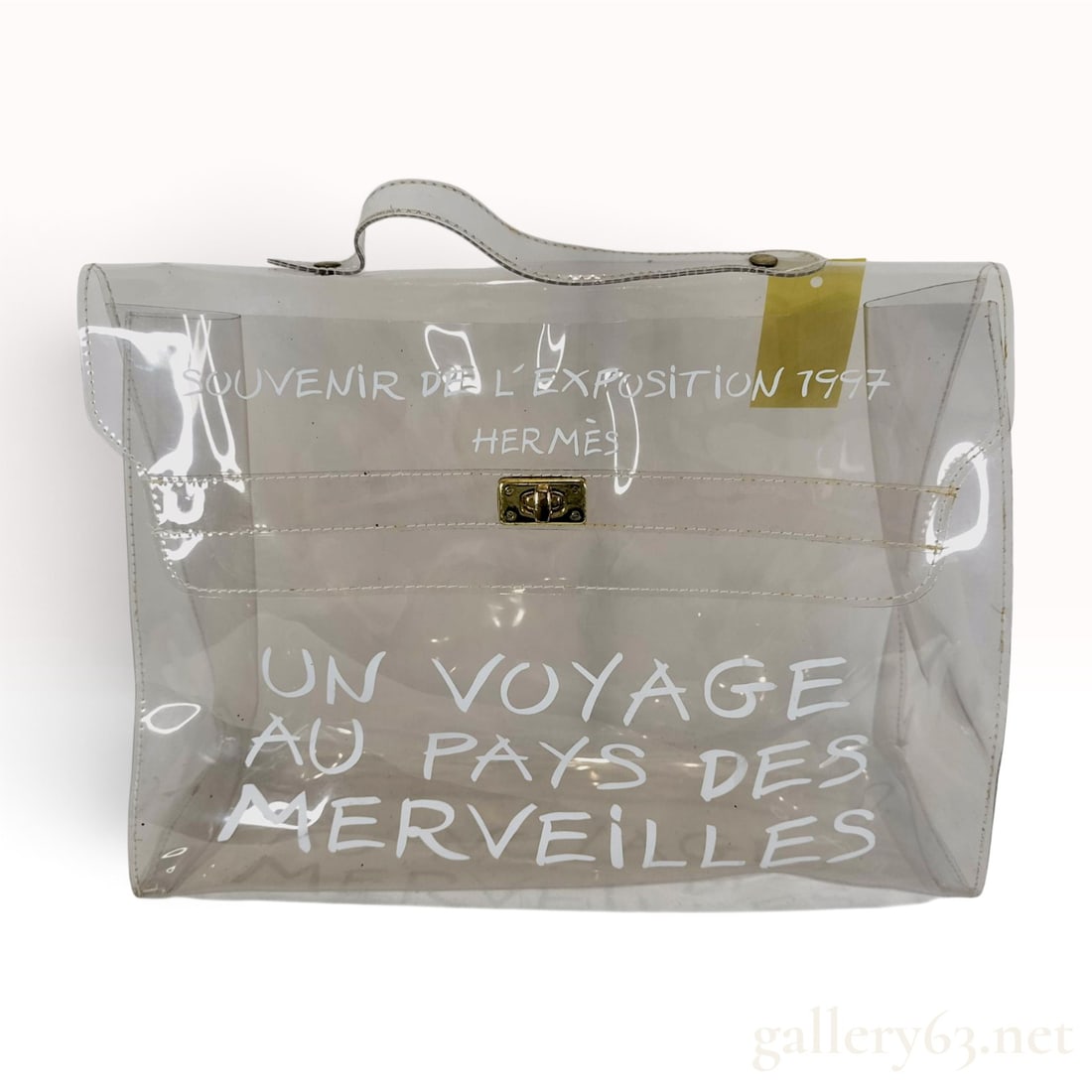 Hermes Vinyl Kelly 40 Souvenir de L'Exposition 1997 Clear Handbag: An Hermes Vinyl Kelly bag, produced as a limited edition souvenir for the 1997 Un Voyage au Pays des Merveilles (A Journey to Wonderland) exhibition in Japan. The bag is constructed from transparent