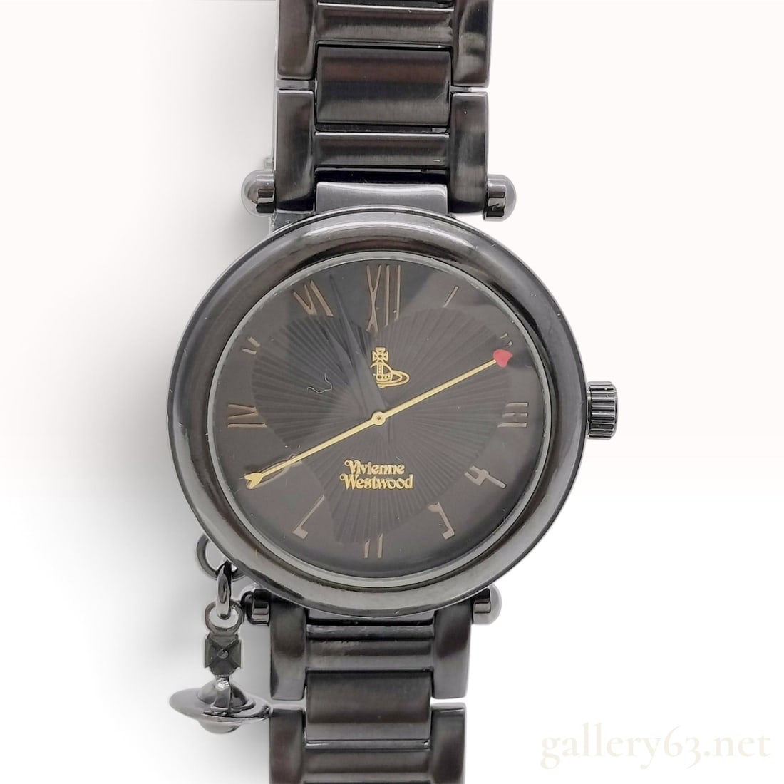 Vivienne Westwood Orb Heart Charm Watch Reference VV006BK: A Vivienne Westwood Orb Heart Charm wristwatch, reference VV006BK, featuring a gunmetal-toned stainless steel case and a matching link bracelet. The black dial is decorated with a sunray guilloche hea