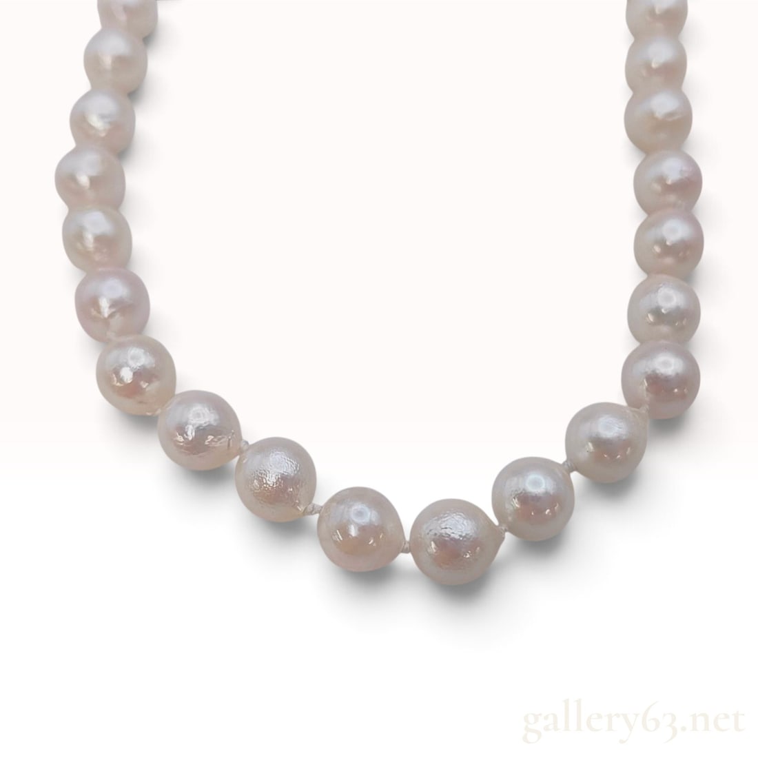 Silver and 6.4mm-6.8mm Semi-Round Pearl Rope Length Necklace: This item is in excellent pre-owned condition. A long rope-length cultured pearl necklace featuring individually knotted pearls. The pearls exhibit a baroque to semi-round shape with a creamy white bo