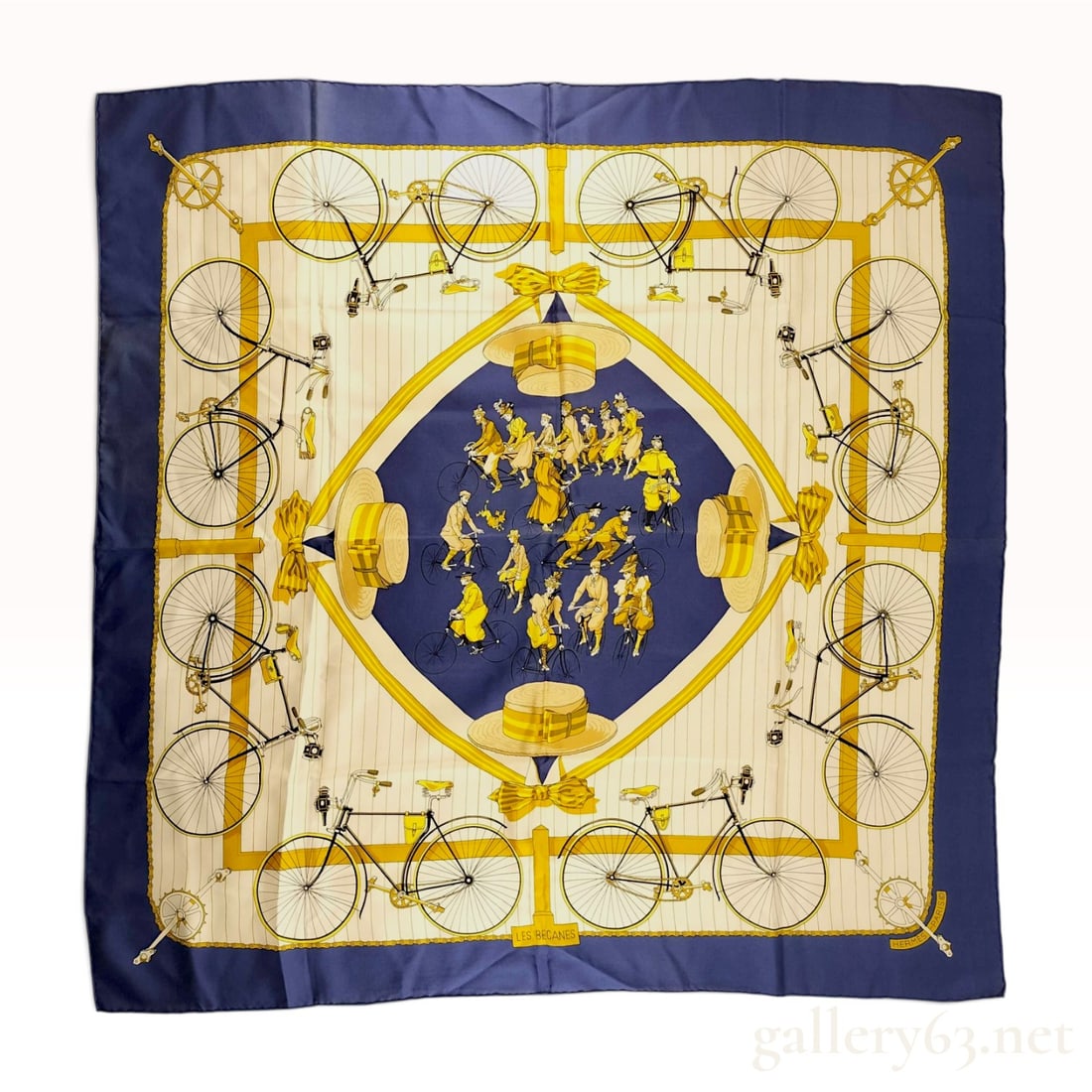 Hermes Les Becanes Silk Scarf by Hugo Grygkar: This authentic Hermes square silk scarf features the Les Becanes pattern, designed by Hugo Grygkar and first issued in 1973. The design includes a navy blue border and a central diamond depicting a gr