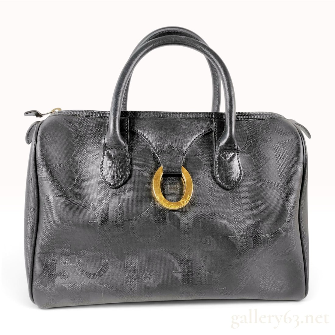 Christian Dior Vintage Black Diorissimo Monogram Boston Bag: A vintage Christian Dior Boston satchel bag crafted from black coated canvas with an embossed Diorissimo monogram pattern. The bag features black leather trim, including rolled top handles and protect