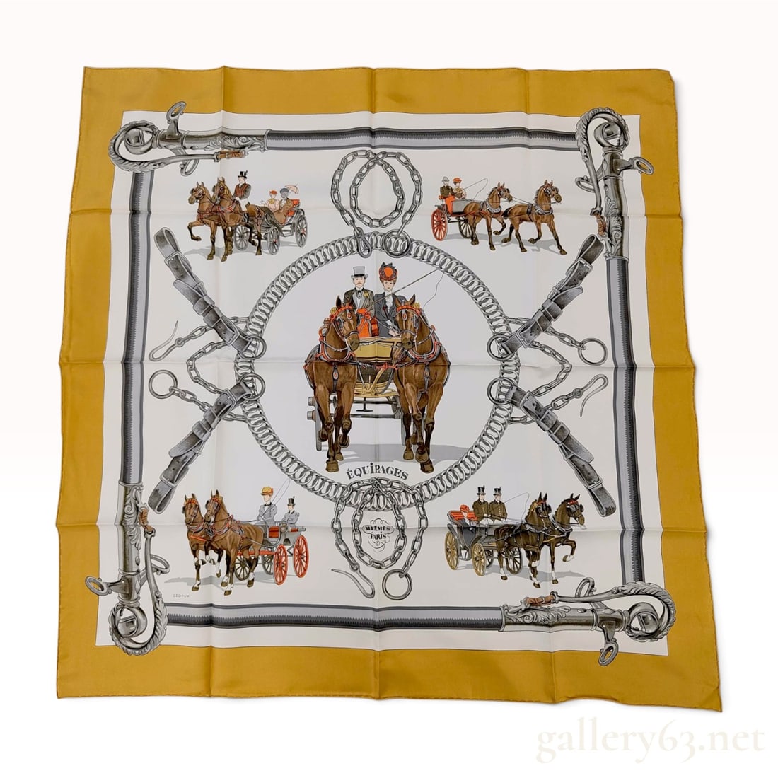 Hermes Equipages Silk Scarf by Philippe Ledoux: Hermes silk twill scarf in the Equipages pattern designed by Philippe Ledoux. The motif depicts nineteenth-century horse-drawn carriages and equestrian hardware in gray, brown, and red tones on a whit