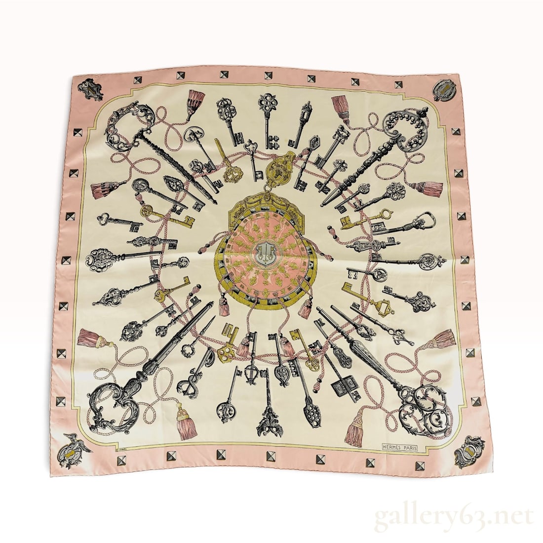 Hermes Les Clefs Silk Scarf in Pink and Cream by Caty Latham: This Hermes silk twill scarf features the Les Clefs (The Keys) pattern, originally designed by artist Caty Latham in 1965. The design displays a central purse-like medallion encircled by a complex arr