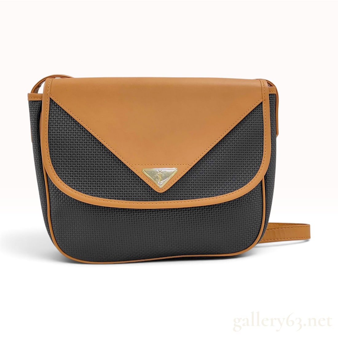 Yves Saint Laurent Vintage Charcoal Woven and Tan Leather Crossbody Bag: This vintage Yves Saint Laurent shoulder bag is constructed with a charcoal gray woven synthetic body in a basket-weave pattern and tan leather accents. The design features a tan leather front flap, p