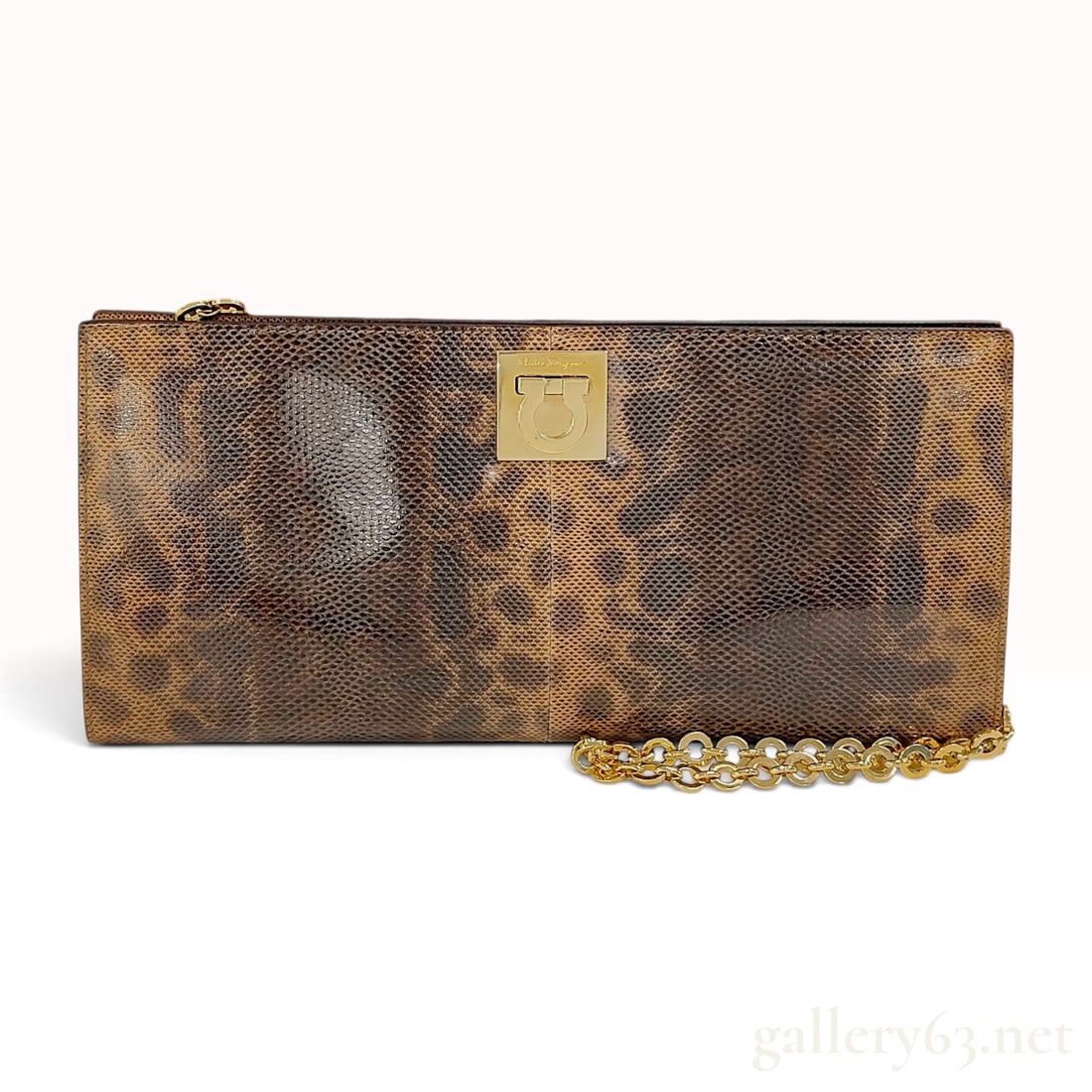 Salvatore Ferragamo Leopard Print Lizard-Embossed Leather Gancini Chain Bag: A Salvatore Ferragamo convertible shoulder bag and clutch. The exterior is constructed from lizard-embossed leather featuring a leopard print pattern in tones of brown and tan. The front is accented w