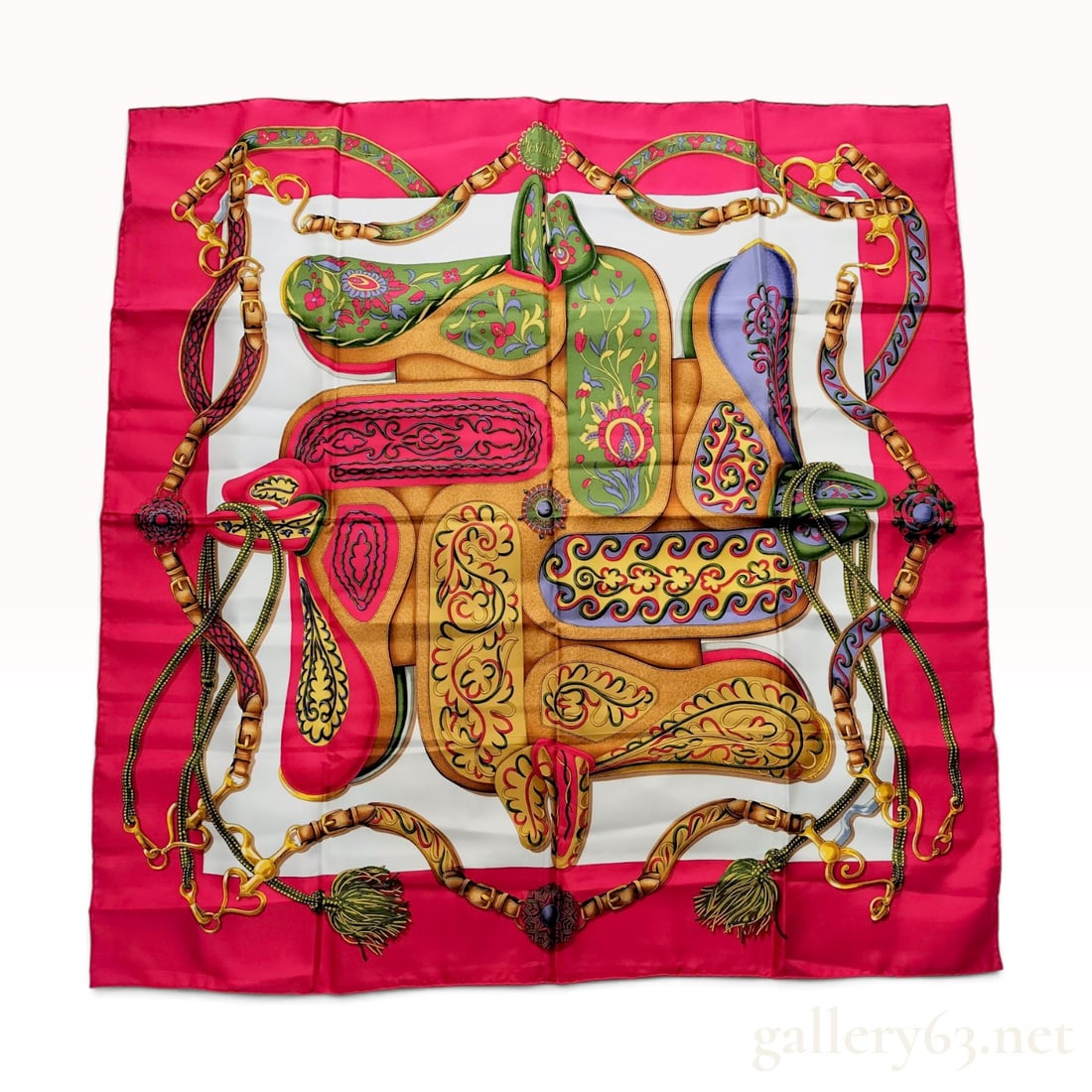 Hermes Festival Silk Scarf: This Hermes silk twill scarf features the Festival pattern designed by Henri d'Origny. The square composition displays a central arrangement of ornate equestrian saddles in shades of green, yellow, la