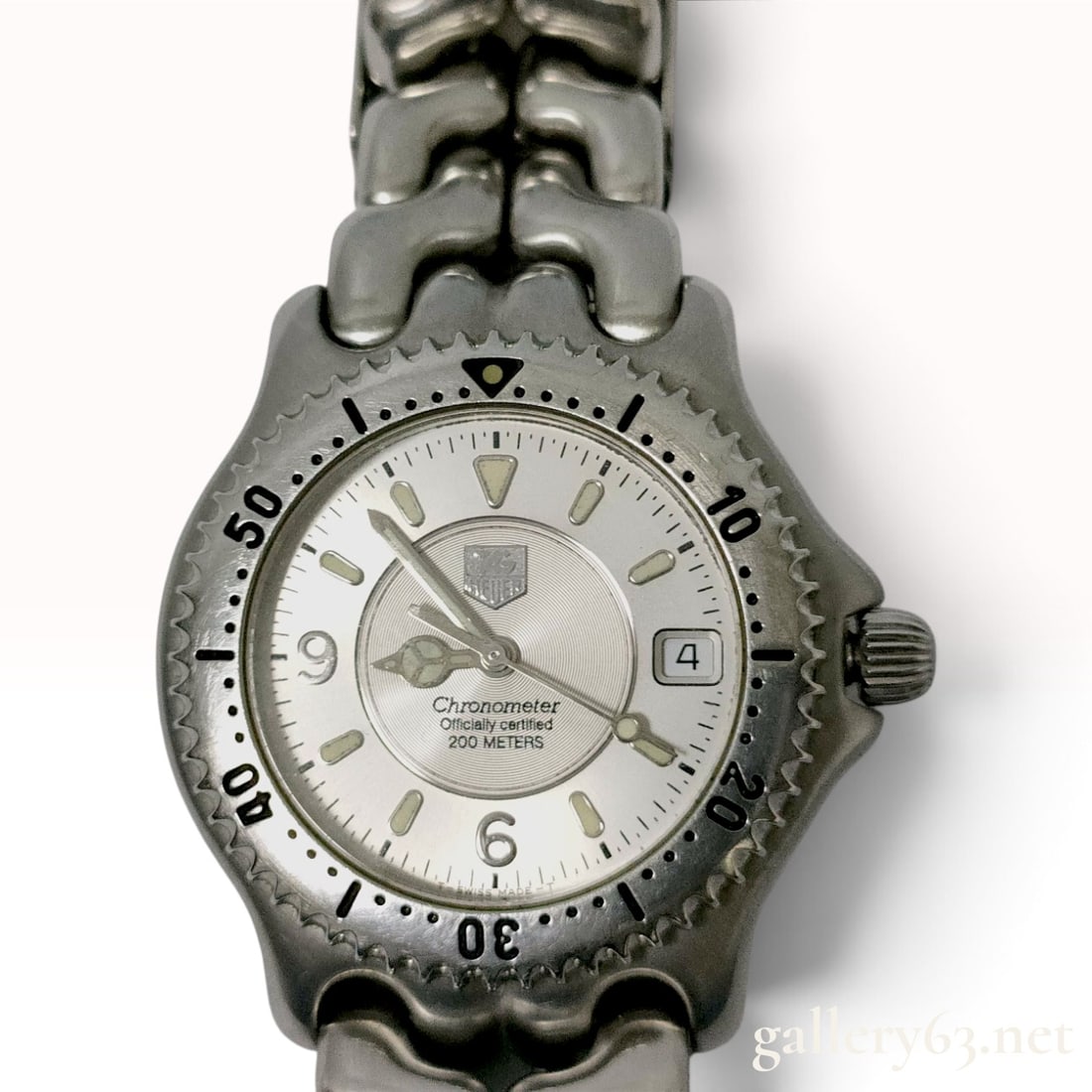 TAG Heuer S/el Automatic Chronometer WG5112-P0: TAG Heuer S/el (Sports and Elegance) series wristwatch, reference number WG5112-P0. This timepiece features a stainless steel case with a unidirectional rotating bezel and the signature interlocking S