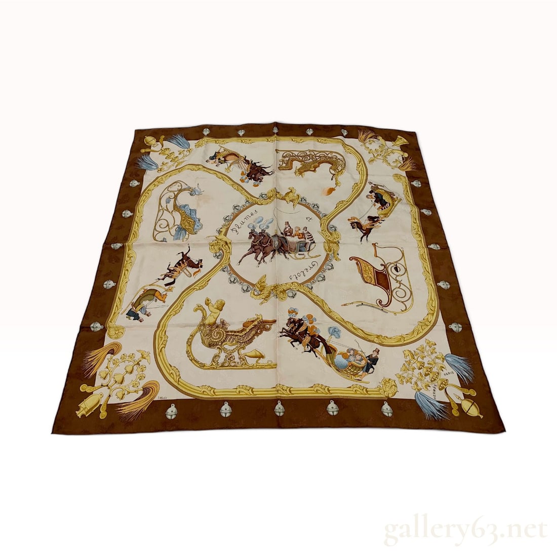 Hermes Plumes et Grelots Silk Jacquard Scarf by Julia Abadie: This Hermes silk scarf features the Plumes et Grelots (Feathers and Bells) pattern, a classic design by artist Julia Abadie. The scarf is constructed from 100% silk jacquard, characterized by a tone-o