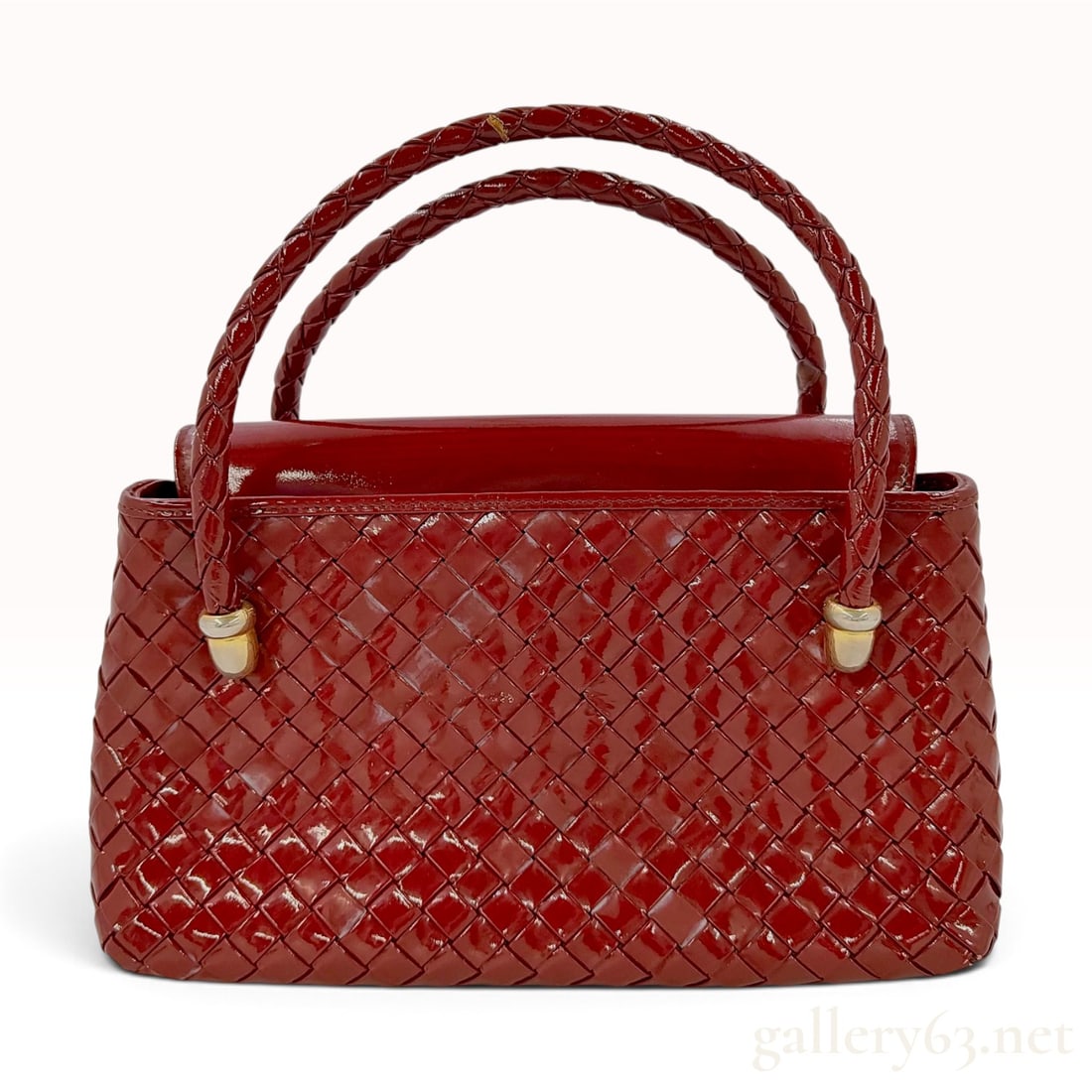 Bottega Veneta Intrecciato Burgundy Patent Leather Small Flap Top Handle Bag: A gorgeous vintage Bottega Veneta handbag crafted from burgundy patent leather in the signature intrecciato woven design. The bag features a structured silhouette with a flap top closure and dual