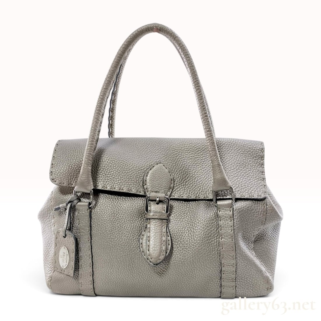 Fendi Selleria Linda Metallic Pebbled Leather Satchel: This Fendi Selleria Linda satchel is crafted from metallic grey pebbled Cuoio Romano leather featuring the line's signature oversized hand-stitched detailing. The bag is designed with double rolled