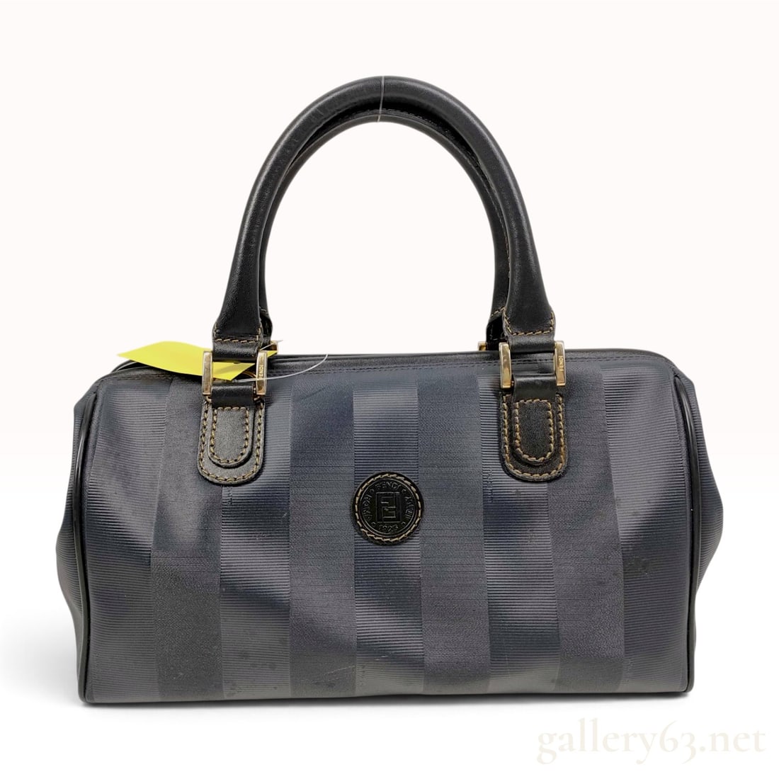 Fendi Pequin Stripe Boston Bag: A vintage Fendi Pequin stripe Boston bag featuring navy blue and black vertical striped coated canvas with a ribbed texture. The bag is trimmed in black leather with matching dual rolled handles and f