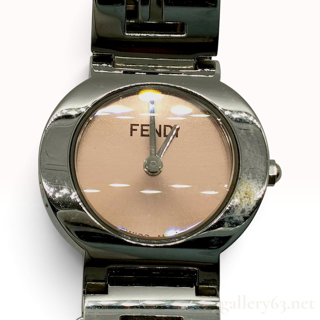 Fendi 3050L Orologi Stainless Steel Ladies Quartz Wristwatch: Fendi 3050L Orologi ladies wristwatch featuring a circular stainless steel case and a light pink sunray dial. The dial is marked FENDI at the 12 o'clock position and SWISS MADE at the 6 o'clock positi