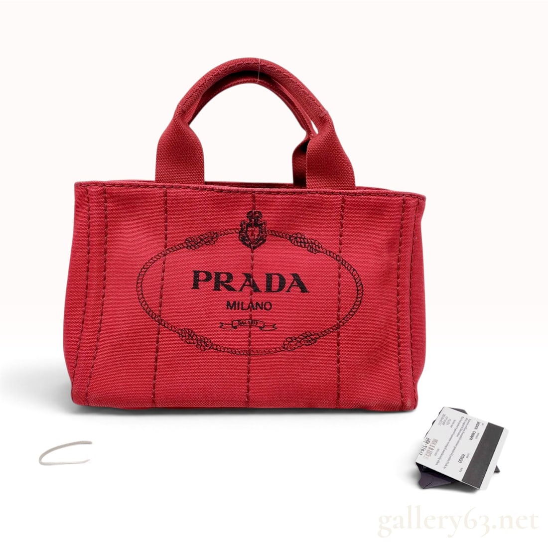 Prada Canapa Small Canvas Tote Bag Rosso BN2439: A Prada Canapa tote bag, model BN2439, constructed from Rosso red heavyweight cotton canvas with tonal stitching. The front panel features a screen-printed black logo reading Prada Milano. A signature