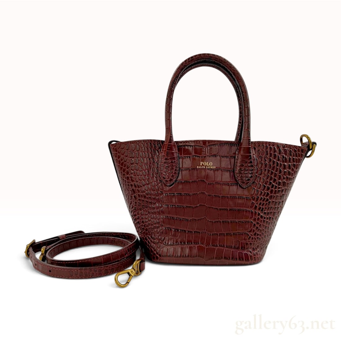 Polo Ralph Lauren Croc-Embossed Leather Mini Bellport Tote: A Polo Ralph Lauren Mini Bellport Tote crafted from glossy crocodile-embossed leather in a deep burgundy shade. The bag features a structured base with flared side panels and dual rolled top handles. 