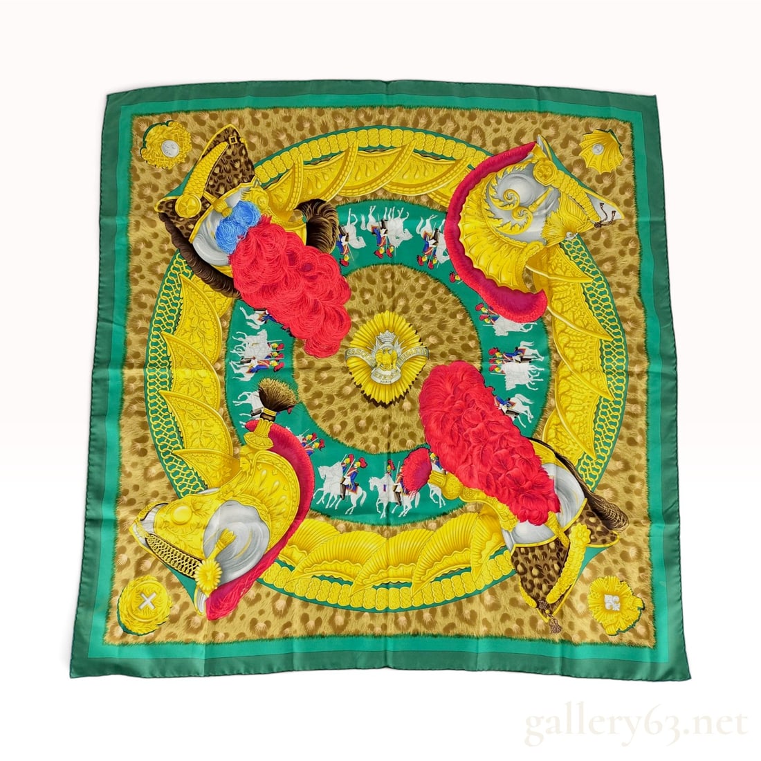 Hermes Casques et Plumets Silk Scarf by Julia Abadie: A vintage Hermes silk twill Carre 90 scarf featuring the Casques et Plumets (Helmets and Plumes) pattern, designed by artist Julia Abadie and first issued in 1989. The design showcases four ornate his