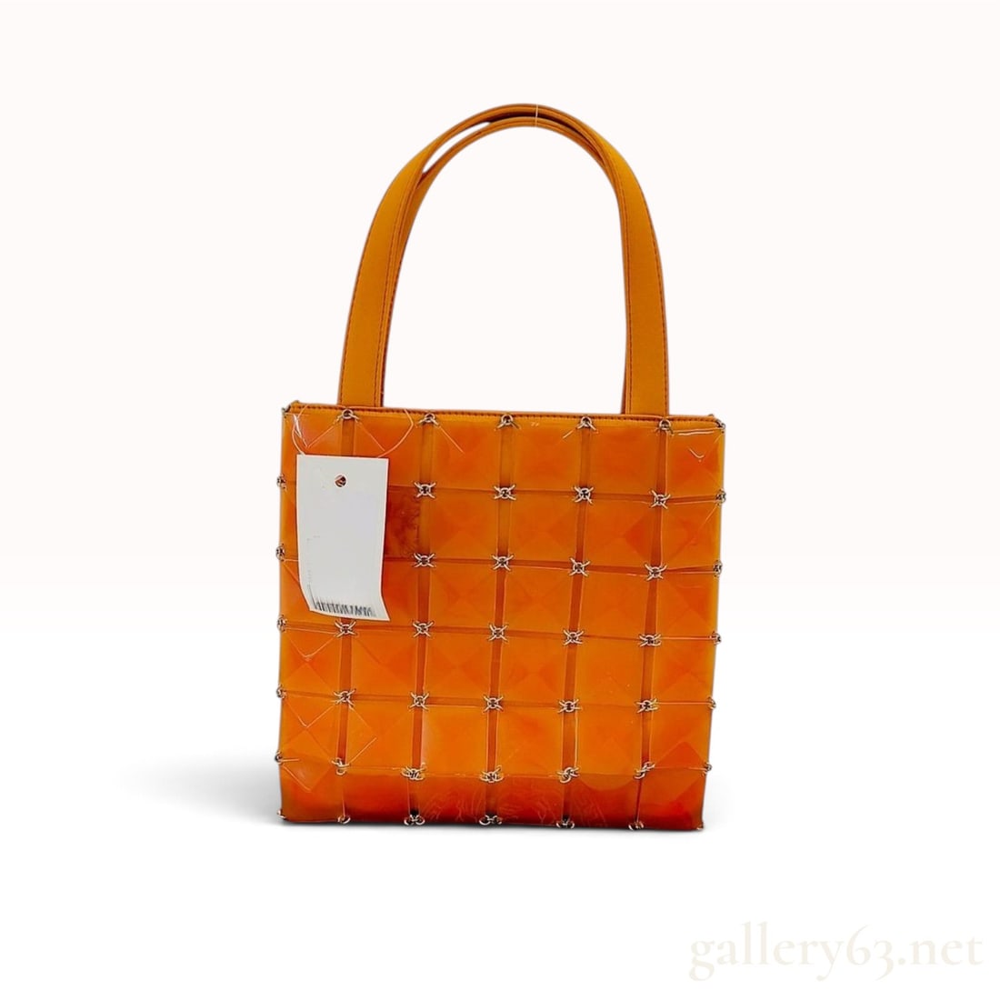 Gianni Versace Orange Faceted Resin Tile Handbag: A vintage Gianni Versace tote bag featuring an architectural exterior composed of faceted vibrant orange resin square tiles. These geometric tiles are interconnected by a system of silver-tone metal j