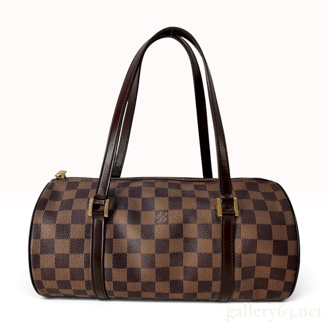 Louis Vuitton Damier Ebene Papillon 30 Handbag: This Louis Vuitton Papillon 30 handbag is crafted from Damier Ebene coated canvas with dark brown leather trim and shoulder straps. The cylindrical bag features a top zipper closure with a gold-tone z