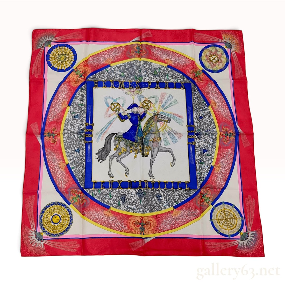 Hermes Paris Feux D'Artifice 150th Anniversary Silk Jacquard Scarf: A square Hermes silk scarf featuring the Feux D'Artifice (Fireworks) pattern, designed by Michel Duchene to commemorate the 150th anniversary of the house (1837-1987). The central motif depicts a ride