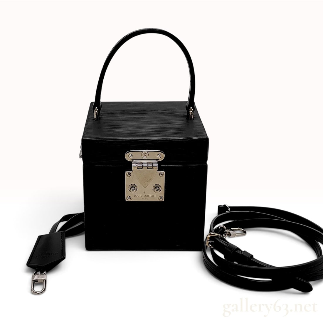 Louis Vuitton Black Epi Leather Bleecker Box Handbag: This Louis Vuitton Bleecker Box handbag is constructed from structured black Epi leather in a cube-shaped silhouette inspired by the brand legacy of trunk making. The exterior features the signature w