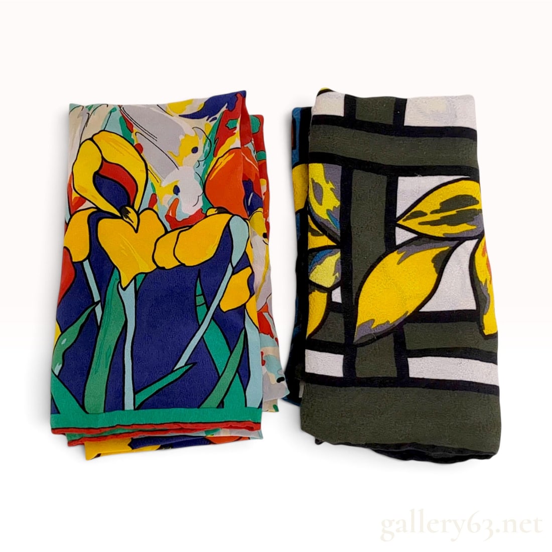 Two Tiffany & Co. 90 cm Silk Scarves: A lot consisting of two silk scarves by Tiffany & Co. featuring distinctive printed designs. The first scarf displays a bright, multi-color floral pattern with yellow and orange irises or lilies among