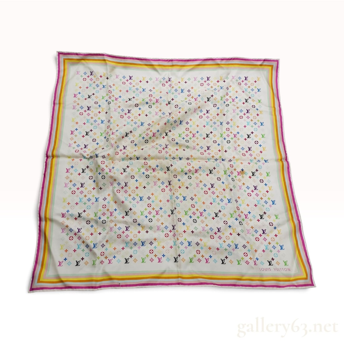 Louis Vuitton x Takashi Murakami Monogram Multicolore Silk Scarf: A Louis Vuitton silk scarf featuring the Monogram Multicolore pattern designed in collaboration with artist Takashi Murakami. The white silk twill ground is printed with repeating multi-colored LV mon