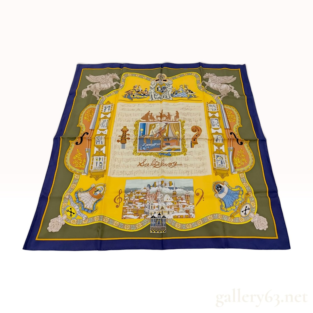 Hermes Carre 90 Silk Scarf in Salzburg Pattern by Loic Dubigeon: This authentic Hermes silk twill scarf, titled Salzburg, was designed by artist Loic Dubigeon and features a complex musical and architectural motif. The central yellow field contains a musical score 