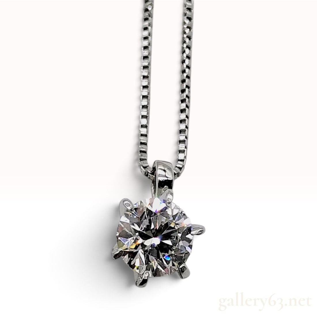 0.301ct Natural Diamond and Platinum Solitaire Pendant Necklace W/CGL Memo: This solitaire pendant necklace is crafted with a single round brilliant-cut natural diamond weighing 0.301ct. The stone is held in a six-prong platinum basket setting and slides on a platinum box cha