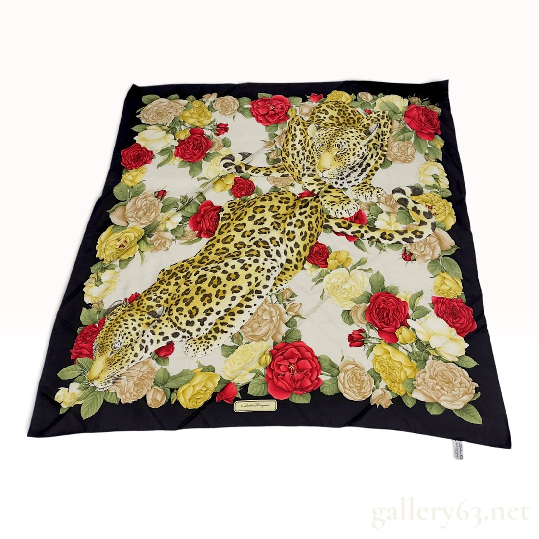 Vintage Salvatore Ferragamo Leopard and Rose Silk Scarf 90cm with Box: This Salvatore Ferragamo silk carre 90 is decorated with an animalier leopard and rose motif. The design features two leopards reclining amidst a dense arrangement of red, yellow, and cream roses with