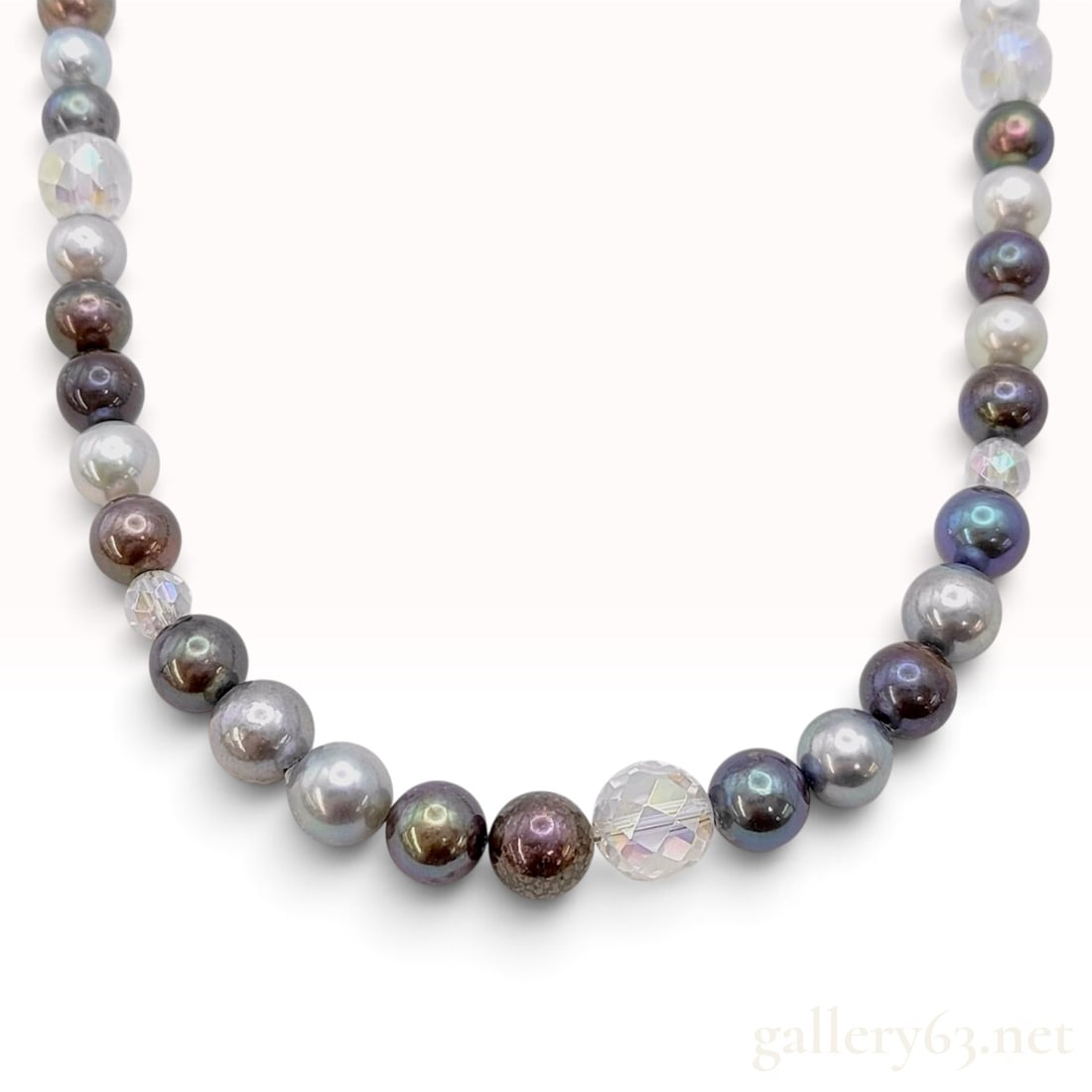 A Vintage Multicolor Cultured Pearl and Crystal Necklace with Silver Clasp: This is a multicolor cultured pearl necklace featuring a single strand of near-round to off-round pearls. The pearls exhibit a varied palette including peacock black, silver-gray, lavender, and cream 